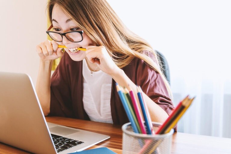 person speaking to smart assistant at desk