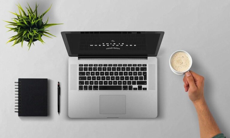 person speaking to smart assistant at desk