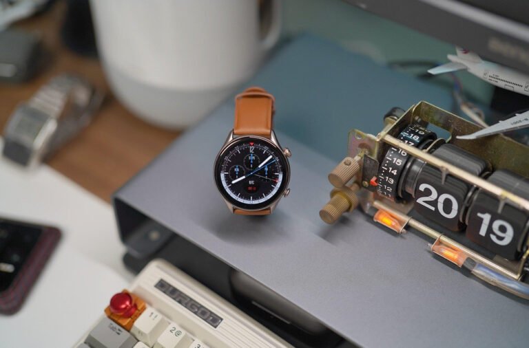 person speaking to smart assistant at desk